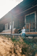 Little boy playing on woodwind flute - ukrainian sopilka. Folk music concept.