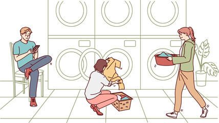 People washing clothes in laundromat