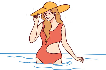 Smiling woman in swimsuit in sea