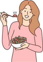 Smiling woman eating salad