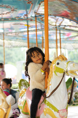 girl on fair horse smiling happily