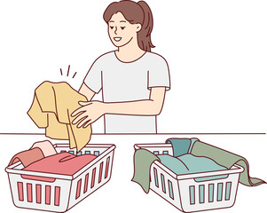 Woman sorting laundry in baskets