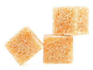 Brown cane sugar cubes isolated on a white background