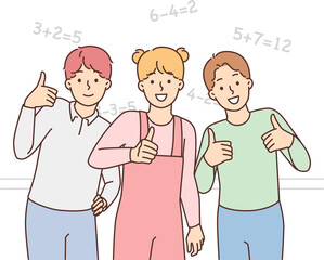 Smiling schoolchildren show thumb up