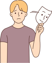 Unhappy man take off smiling mask