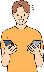 Smiling man holding cellphones