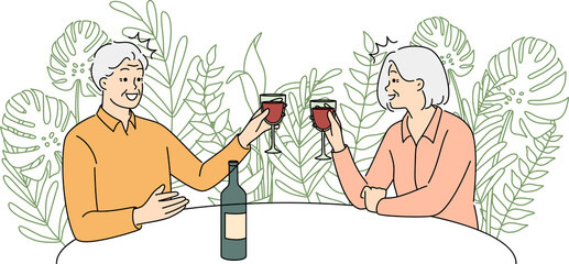 Elderly couple drinking wine in restaurant