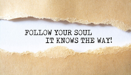 Follow Your Soul It Knows The Way. Words written under torn paper. Motivation concept text.