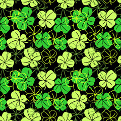seamless pattern of green contours and silhouettes of a four-leaf clover on a black background, texture design