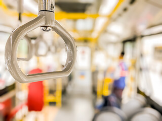 Isolated focus. Railway Stainless steel hand holder inside public buses transportation highly required for providing safety and comfying passengers during the trip.