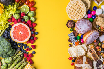 Obraz na płótnie Canvas Healthy and unhealthy food concept. Fruits and vegetables vs sweets top view flat lay