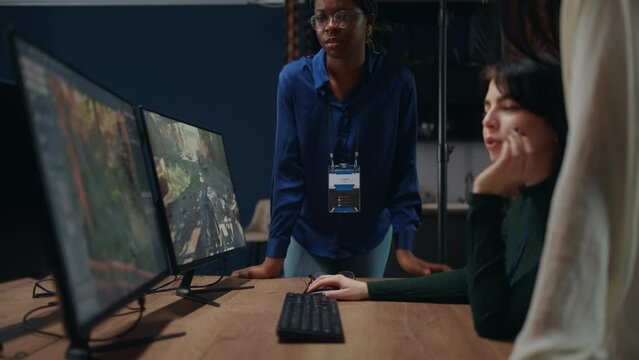 multiethnic team of game designers discussing new project in office, group of female IT specialists