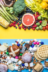 Healthy and unhealthy food concept. Fruit and vegetables vs sweet top view flat lay on rustic background