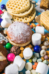 Unhealthy products. food bad for figure, skin, heart and teeth. Assortment of fast carbohydrates food with candy