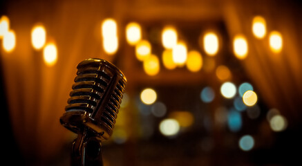 Metal microphone on blurred background with bokeh lights - obrazy, fototapety, plakaty