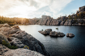 Scenic view of sylvan lake and rock formation against sky at Custer state park