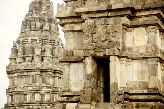 Carvings on walls of Prambanan temple against clear sky