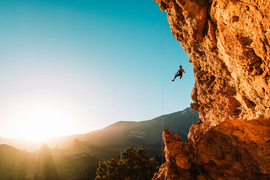 Rock climber hanging from rope,Â ElÂ TeideÂ National Park,Â Tenerife, Canary Islands, Spain