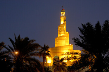 A tall, spiral minaret in Doha, Qatar.