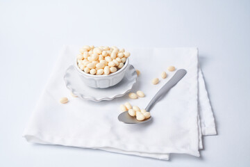 Probiotic and lactobacillus capsules  in a bowl with a white background