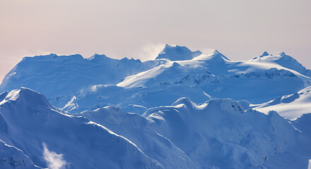 Snow and Cloud covered Canadian Nature Landscape Background. Winter Season in Whistler, British...