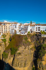 Fototapeta na wymiar View of buildings on top of gorge in Ronda, SpainView of buildings on top of gorge in Ronda, Spain
