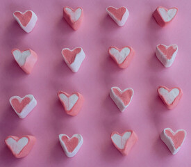 Fototapeta premium heart shaped candies pink. Background