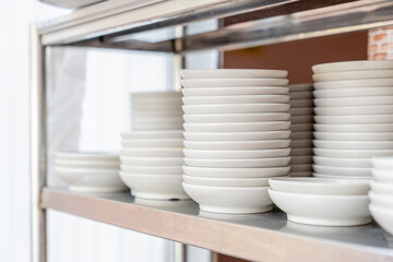 Stacked white bowls in a Korean restaurant