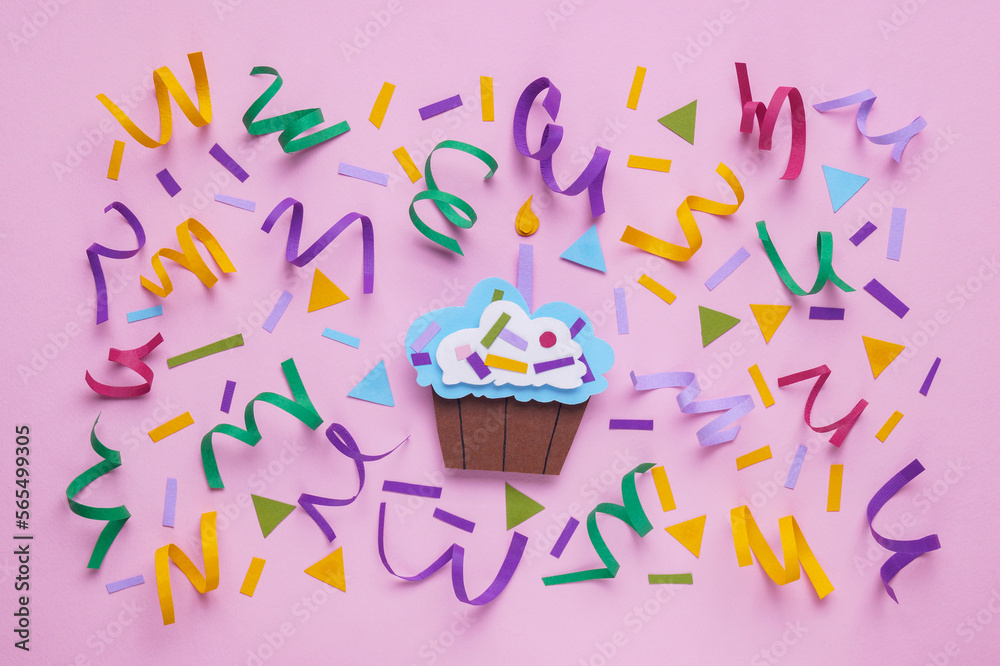 Sticker Birthday party. Paper cupcake and confetti on pink background, flat lay