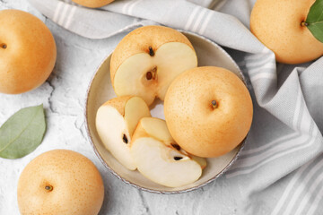 Delicious apple pears on white textured table, flat lay