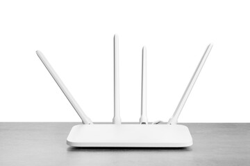New modern Wi-Fi router on grey table against white background