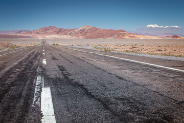 Road in Moon Valley dramatic landscape at Sunset, Atacama Desert, Chile