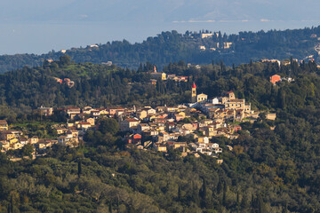 Corfu island view from Kaiser's Throne observation deck lookout, Pelekas village, Greece, Kaiser William II summit Observatory panoramic summer view with mountains, sea and Kerkyra in a background