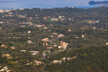 Corfu island view from Kaiser's Throne observation deck lookout, Pelekas village, Greece, Kaiser William II summit Observatory panoramic summer view with mountains, sea and Kerkyra in a background