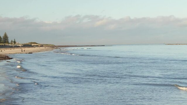 People Walk on Semaphore Beach in Morning during Winter from Jetty View