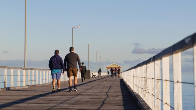 Couple Walk on Jetty in Semaphore during Morning Light
