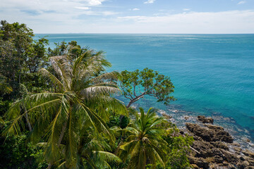 Fototapeta na wymiar Tropical trees and Andaman Sea on sunny day. Ko Lanta island, Krabi Province, Thailand.