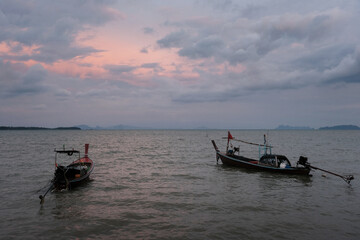Traditional thai longtail boats at sunset. Ko Lanta Old Town, Thailand.