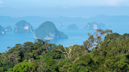 Fototapeta na wymiar View of islands in the sea and forest from Dragon's Crest (Ngon Nak) Trail on sunny day. Krabi Province, Thailand.
