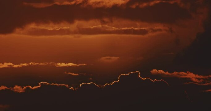 Big sun rising through clouds, 4K time laps nature background