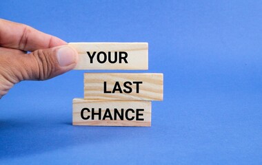 hand placing a stick with the words Your last chance. last chance concept for you