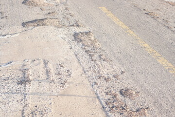 Obraz premium Dilapidated country road There are a lot of holes.