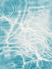 Defocus blurred transparent blue colored clear calm water surface texture with splashes and bubbles. Trendy abstract nature background. Water waves in sunlight with copy space. Blue water shine