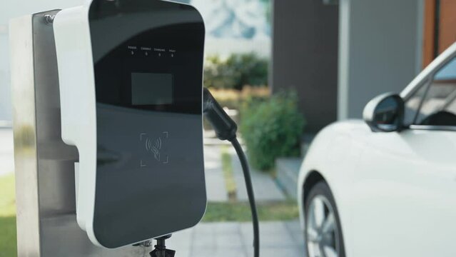 Home charging station provides an eco-friendly sustainable power supply for EV cars. Progressive concept for future green energy storage for electric vehicles.