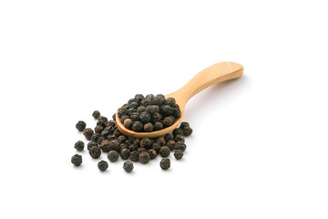 Black pepper or peppercorns in wooden spoon with floor isolated on white background.