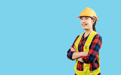 Young female engineer wearing yellow helmet with charming smile posture