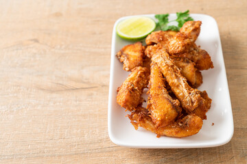 Fried Snapper Belly on white plate
