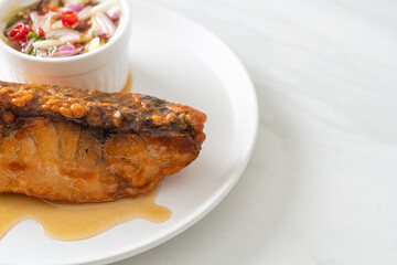 fried snapper fish with fish sauce and spicy salad