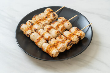 grilled tube shaped fish paste cake skewe or tube squid skewer