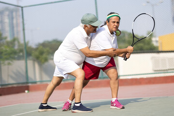 Beautiful young girl on an open tennis court playing tennis.